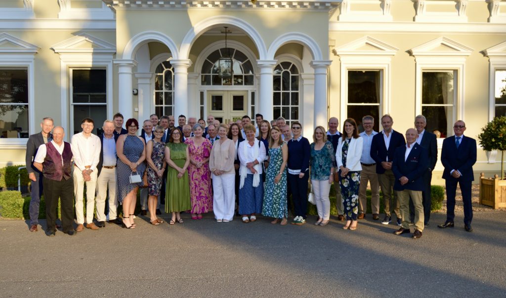 the staff at burhill group stood outside the georgian mansion at burhill golf club
