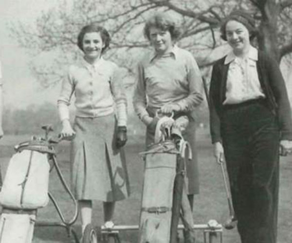 group of ladies playing golf from the 1940s as a black and white photo