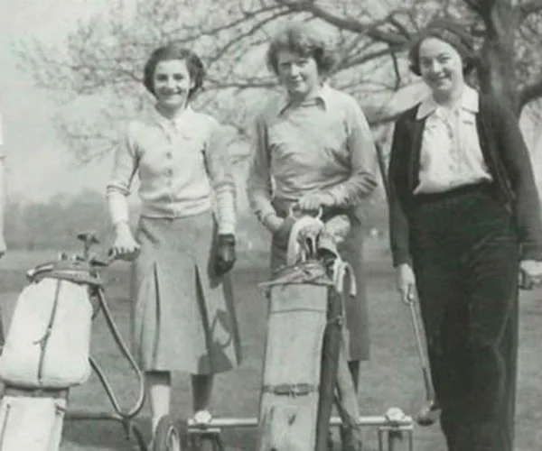 group of ladies playing golf from the 1940s as a black and white photo
